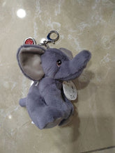 Load image into Gallery viewer, Porte-clés en forme de petit éléphant en peluche grise, vue de profil mettant en valeur la texture douce et la trompe
